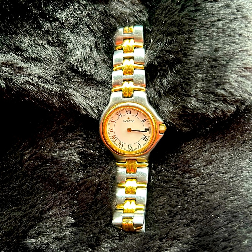 Movado gold and silver, stainless steel Olympian 26 mm Quartz women’s watch.